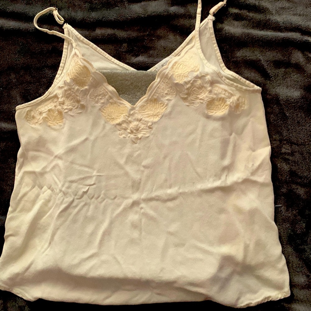 Eggshell white with cream floral detail on lining of chest.